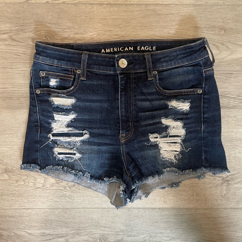 High-wasted, dark wash, distressed jean shorts. American Eagle brand. Size 8.